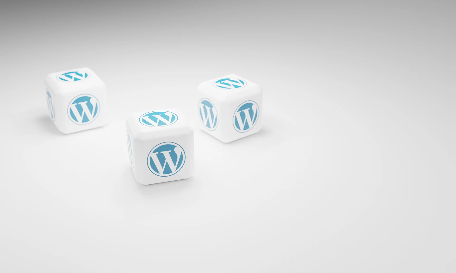Drie dobbelstenen met het WordPress-logo